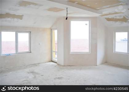 Empty unfinished room in a new constructed building