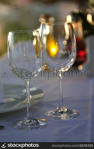 empty vine glasses at outdoor restaurant