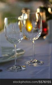 empty vine glasses at outdoor restaurant