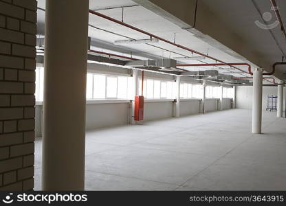 Empty warehouse room with windows