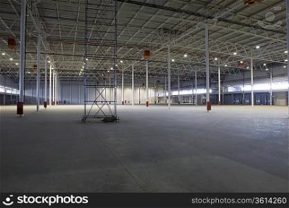 Empty warehouse with scaffold