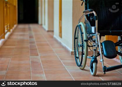 empty wheelchair in hospital corridor