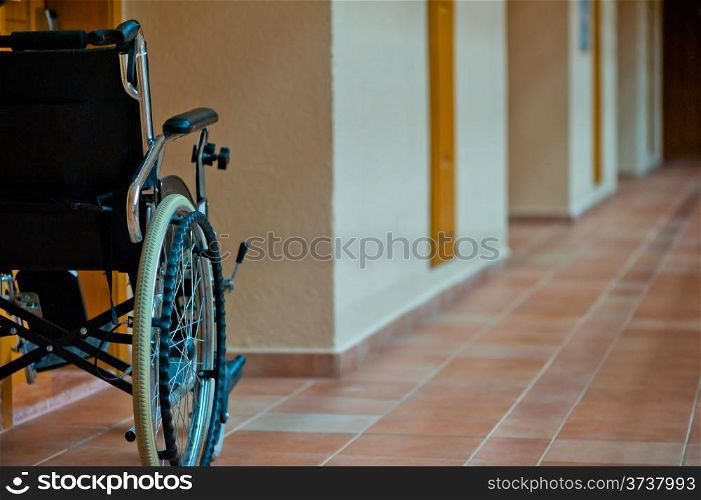 empty wheelchair in the hallway for the disabled