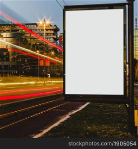 empty white billboard with light trails city night. Beautiful photo. empty white billboard with light trails city night