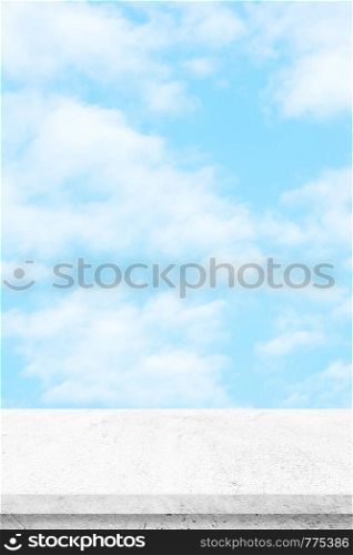Empty white cement table over blue sky nature background, product display montage