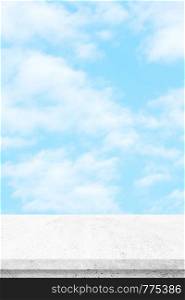 Empty white cement table over blue sky nature background, product display montage