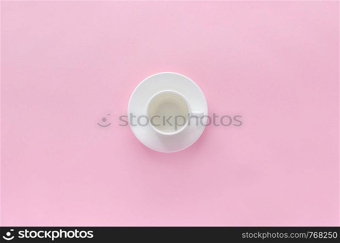 empty white coffee cup and dish saucer on pink background, Top view Copy space, Flat lay . empty white coffee cup and dish saucer on pink background