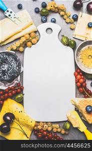 Empty White cutting board and Variety of Delicious cheese with berries and honey for dessert or Breakfast , top view, frame