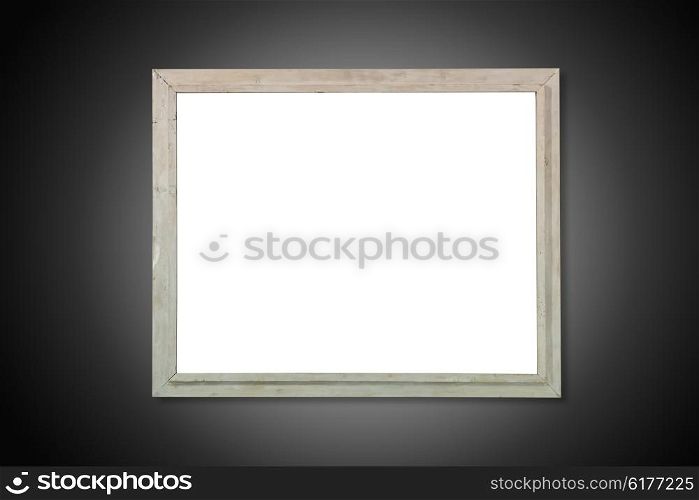 Empty white isolated wooden old frame on the black background