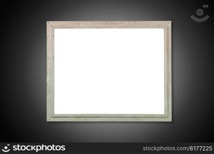 Empty white isolated wooden old frame on the black background
