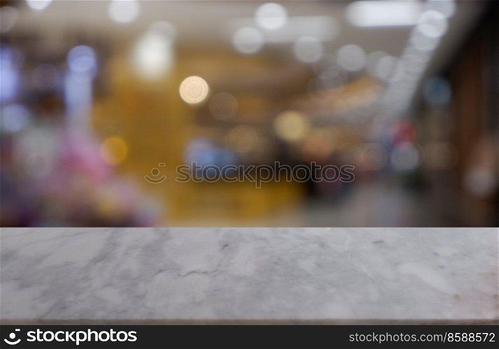Empty white marble stone table in front of abstract blurred background of shopping mall, cafe and coffee shop interior. can be used for display or montage your products - Image