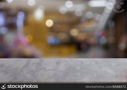 Empty white marble stone table in front of abstract blurred background of shopping mall, cafe and coffee shop interior. can be used for display or montage your products - Image