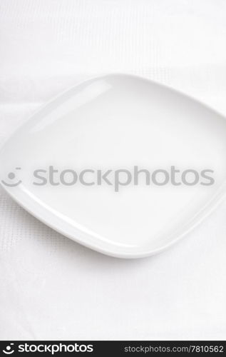 Empty white plate on a white napkin. Fill it! Make a photo collage!