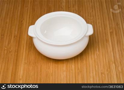empty white pot on bamboo countertops background