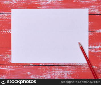 empty white rectangular sheet of paper and red wooden pencil on red wooden background, top view