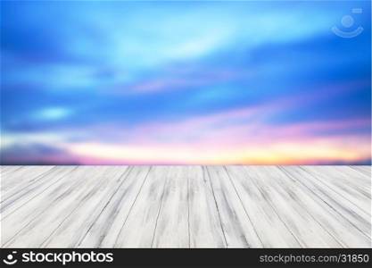 Empty white table top wooden with sunset background. For product display