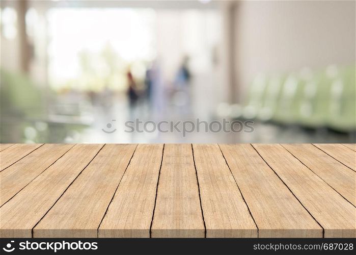 Empty white wood table top on blur hospital interior for background,space for montage products