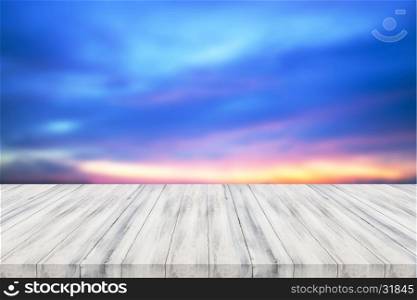 Empty white wooden table top with sunset background. For product display