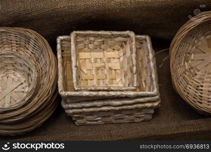 Empty wicker baskets are for sale in a market