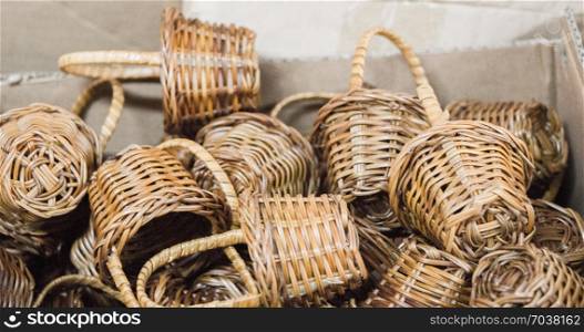Empty wicker baskets are for sale in a market