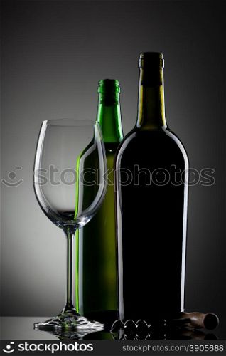 empty wine glass and bottles