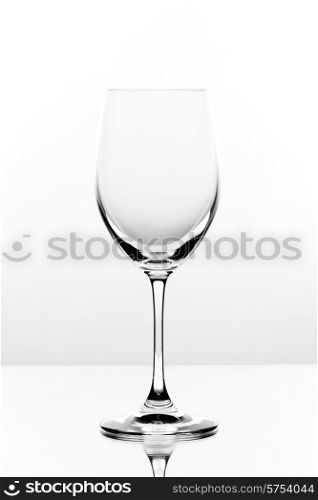 Empty wine glass on a white background. Empty wine glass