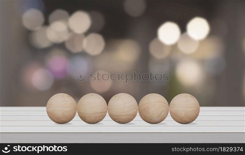 Empty wood sphere on wooden white table over blur bokeh background for your creative.