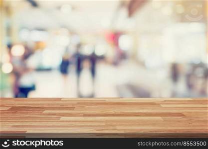 Empty wood table and Blurred background display montage for advertising and product at shopping in department store. Defocused blur background.