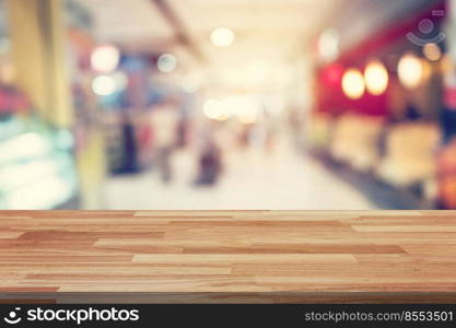 Empty wood table and Blurred background display montage for advertising and product at shopping in department store. Defocused blur background.