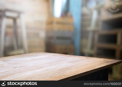 empty wood table in front of blur coffee shop / restaurant background, image can be place product