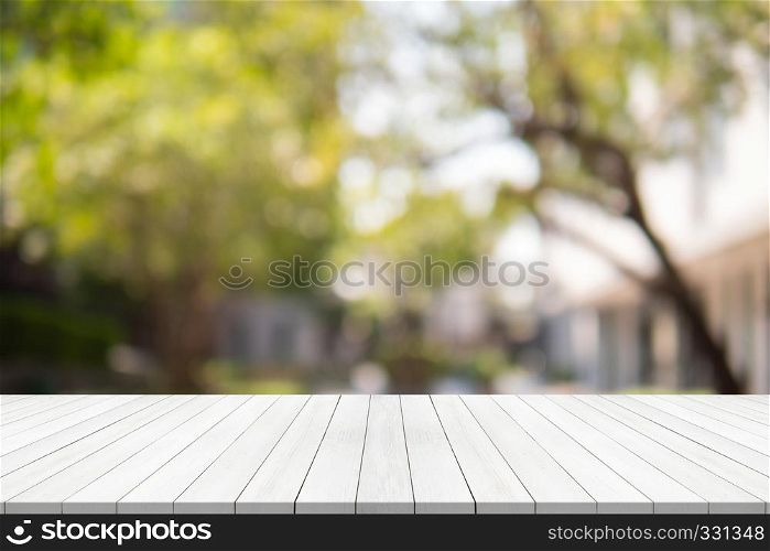 Empty wood table on blurred background copy space for montage your product or design,Blank white board with abstract blurred background
