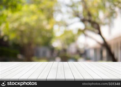 Empty wood table on blurred background copy space for montage your product or design,Blank white board with abstract blurred background