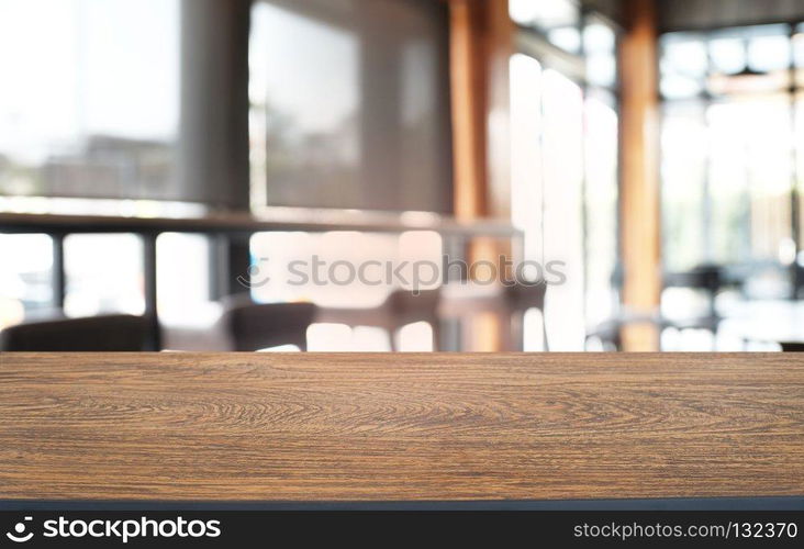 Empty wood table top and blur of night market background/selective focus .For montage product display