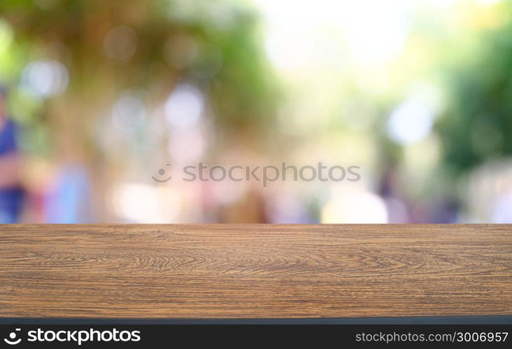 Empty wood table top and blur of night market background/selective focus .For montage product display