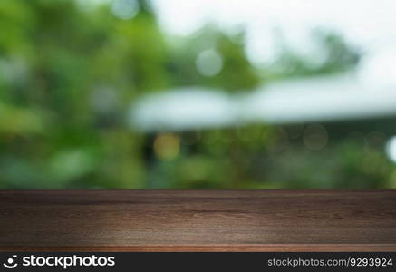 Empty wood table top and blur of out door garden background Empty wooden table space for text marketing promotion. blank wood table copy space background