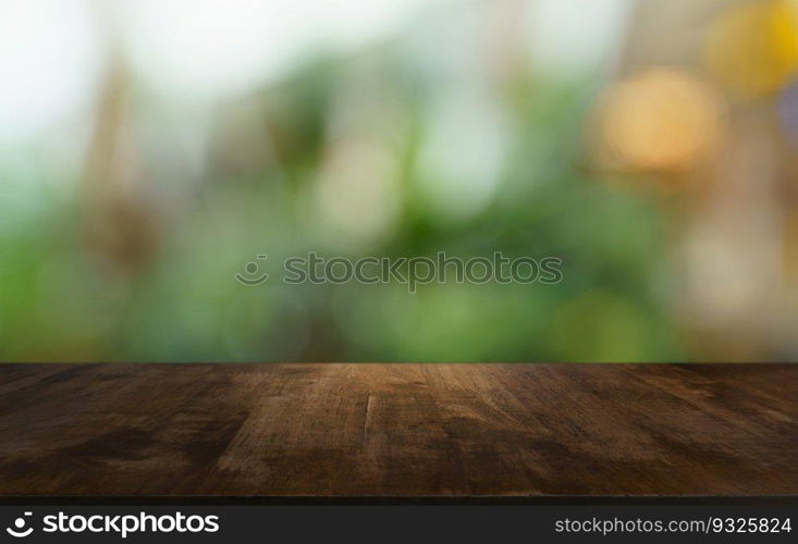 Empty wood table top and blur of out door garden background Empty wooden table space for text marketing promotion. blank wood table copy space background