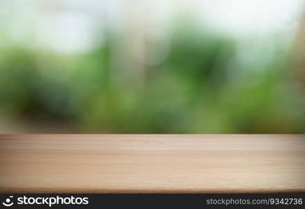 Empty wood table top and blur of out door garden background Empty wooden table space for text marketing promotion. blank wood table copy space background