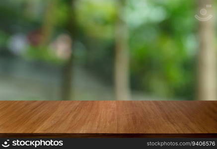 Empty wood table top and blur of out door garden background Empty wooden table space for text marketing promotion. blank wood table copy space background