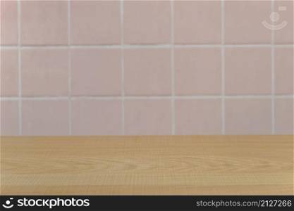 Empty wood table top and blur pink ceramic tile pattern wall in background, Mock up template for display of your product.