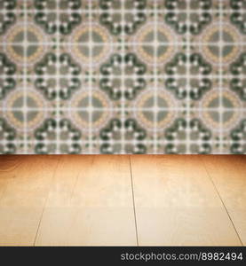 Empty wood table top and blur vintage ceramic tile pattern wall in background, Mock up template for display of your product.