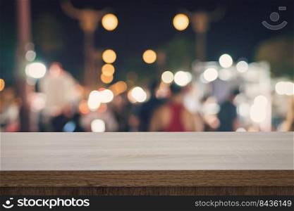 Empty wood table top for product display montage and blurred bokeh night. 