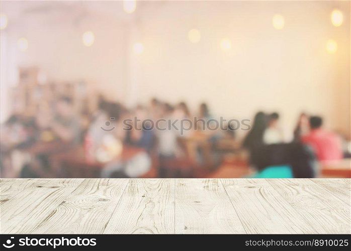 Empty wood table top on blur abstract of customer in restaurant background, for montage product display