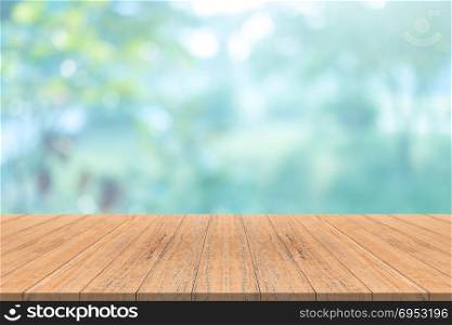 Empty wood table top on blurred background,for montage your products