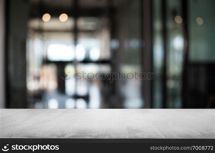 empty wood table with blur montage coffee shop cafe background.