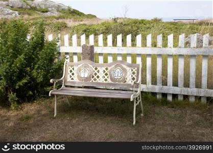 Empty wooden bench on a sunny day