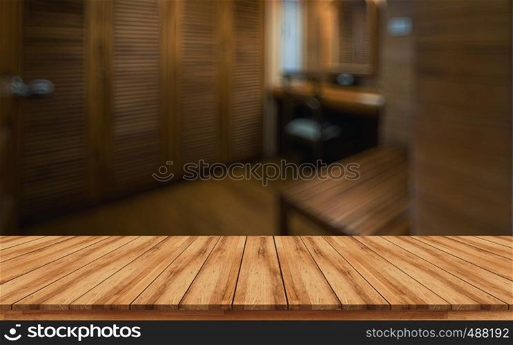 Empty wooden board with blurred spa room background design for health and fitness concept can use for montage products display or design key visual layout.