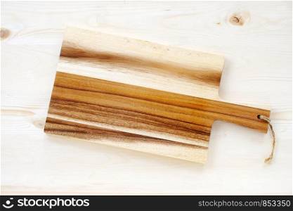 Empty wooden chopping board on table, food display montage background
