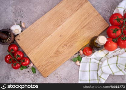 empty wooden cutting board with copy space on grey kitchen table.. empty wooden cutting board with copy space on grey kitchen table