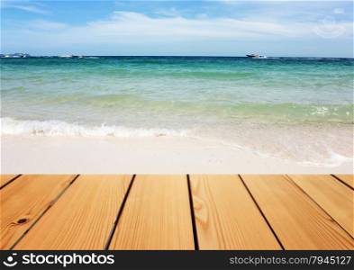 Empty wooden deck table over sea background, Summer concept