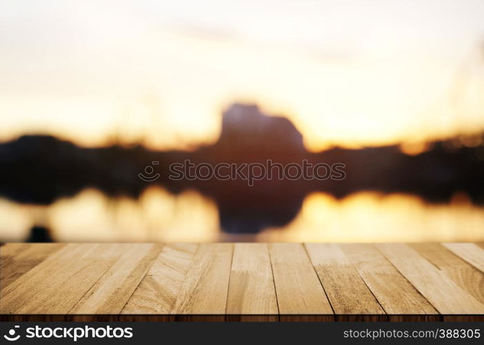 empty wooden deck, table top over blur outdoor market background.